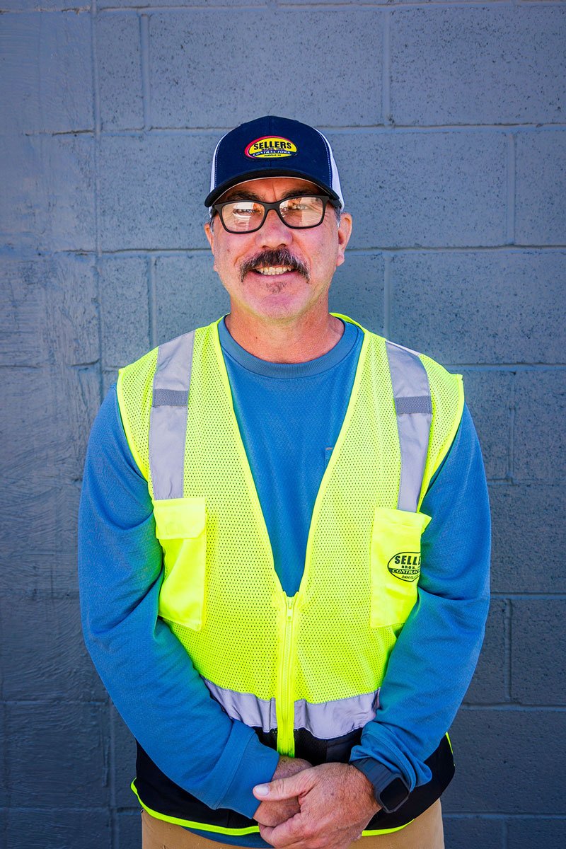 Sellers Brothers crew member Chris Blevins in branded safety vest at the Danville VA shop