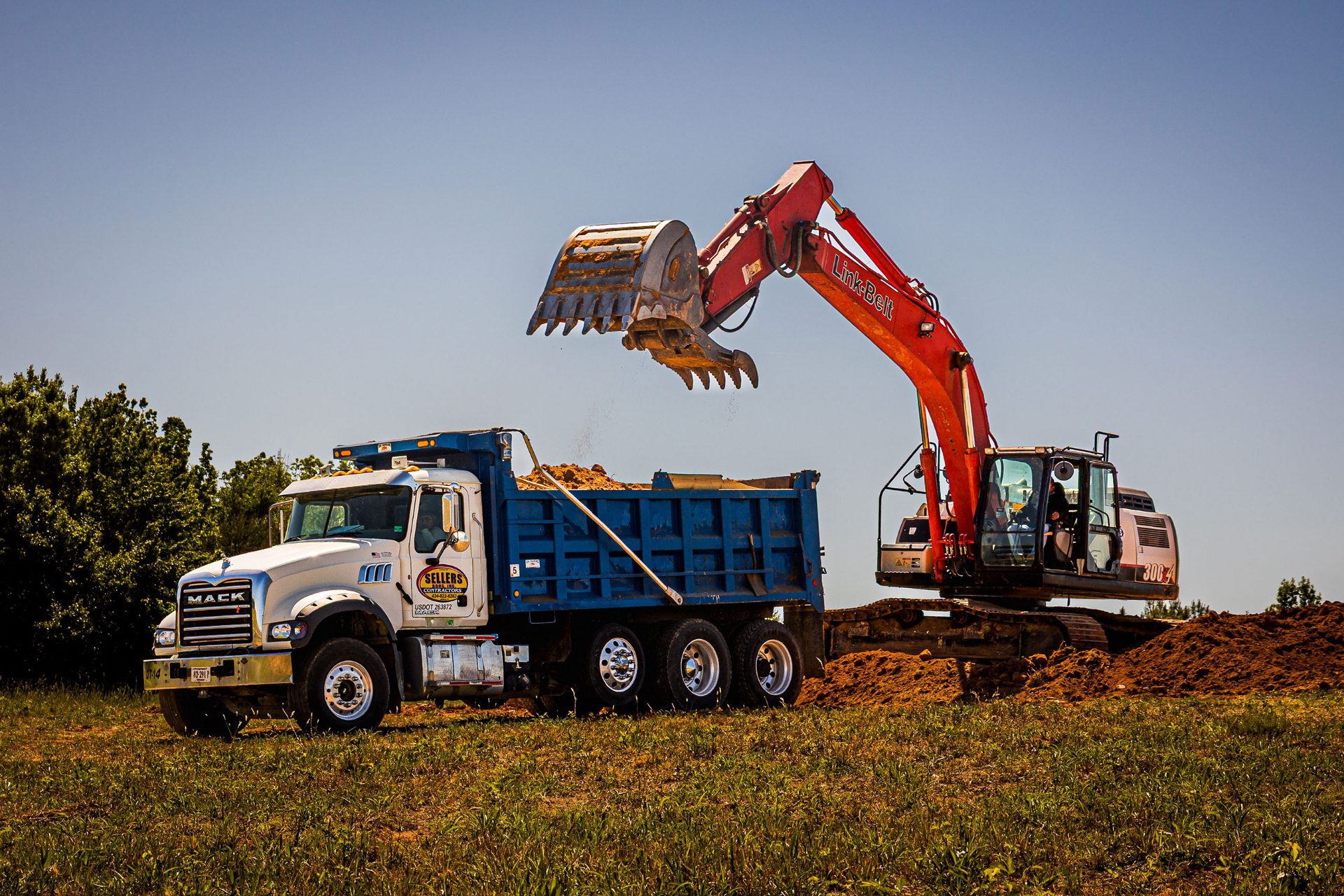 Sellers Brothers Mack dump truck being loaded by Link-Belt excavator on a Danville VA jobsite