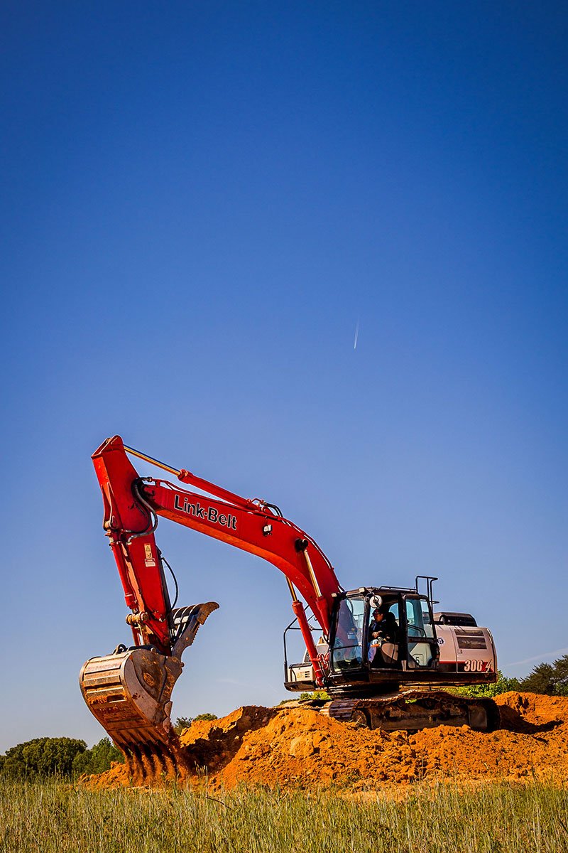 Sellers Brothers Link-Belt excavator on a Southside Virginia jobsite under clear blue sky