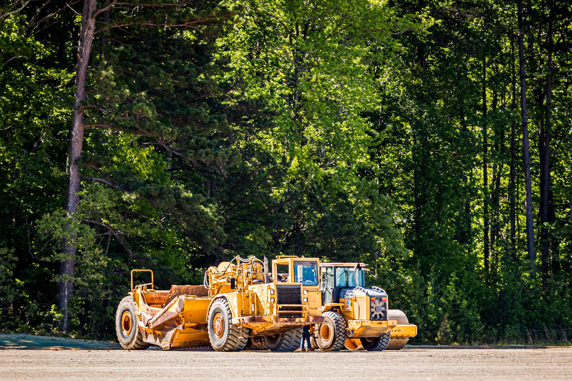 Sellers Brothers heavy equipment — scraper and compactor working a Danville VA site